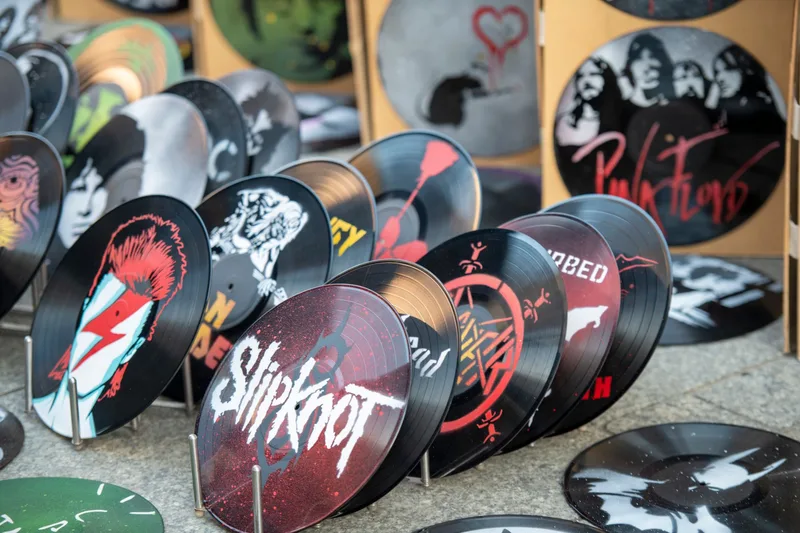 Collection of vinyl records and album art representing direct-to-fan music sales