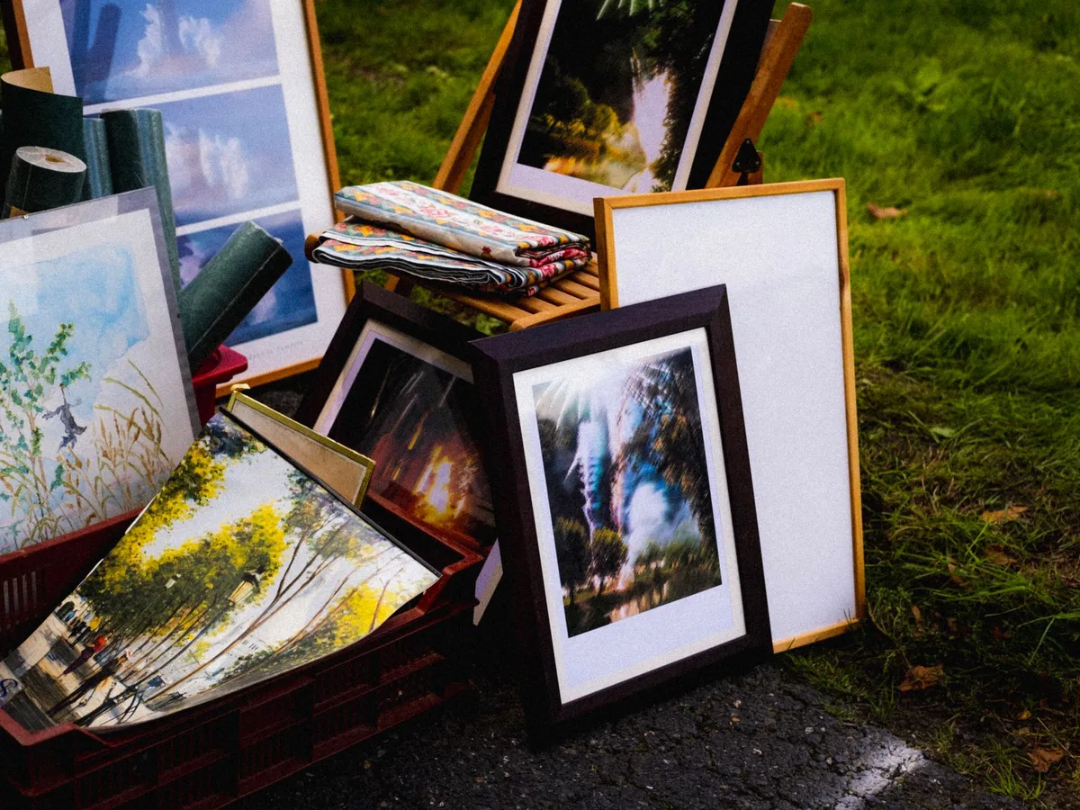Various framed art prints displayed outdoors, showing the range of styles that sell well as prints