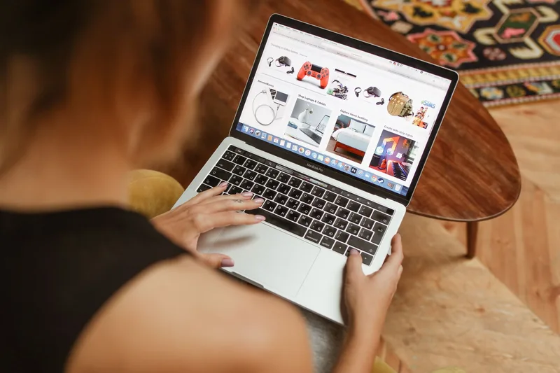 Shopper browsing a grid of product listings on a laptop