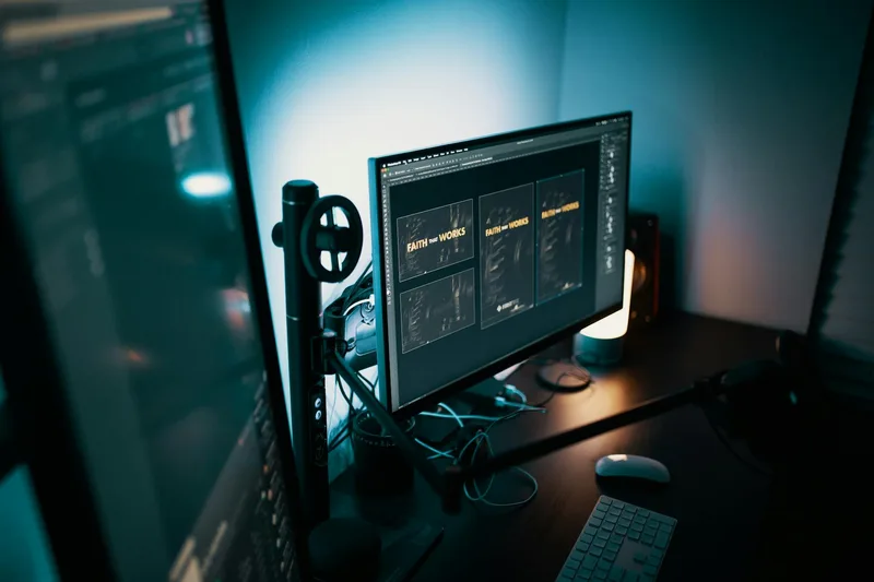 Design templates and digital assets displayed on a professional monitor